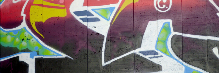 Colorful background of graffiti painting artwork with bright aerosol outlines on wall. Old school...