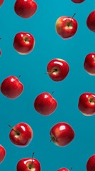Pattern composition of apples on blue background. Minimalist food concept.