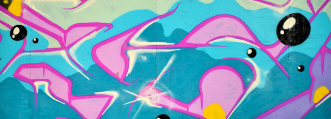 Colorful background of graffiti painting artwork with bright aerosol outlines on wall. Old school...