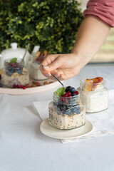 Healthy breakfast of oatmeal and berries in a jar