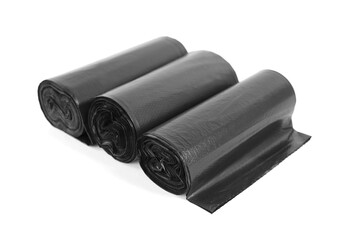 Rolls of black garbage bags isolated on white