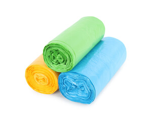 Rolls of colorful garbage bags isolated on white