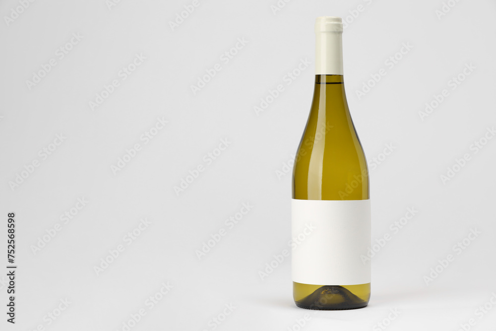 Poster Bottle of tasty wine on white background, space for text