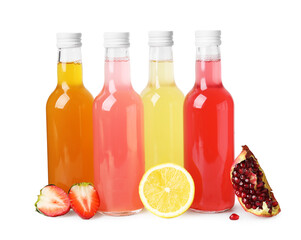 Delicious kombucha in glass bottles and fresh fruits isolated on white