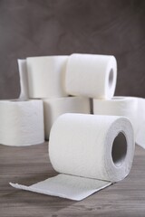 Soft toilet paper rolls on wooden table