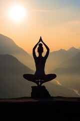 A person sitting in a yoga pose on a rock. Ideal for health and wellness concepts