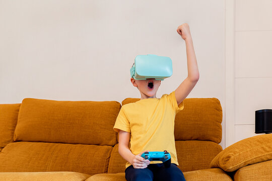 Excited child playing with virtual reality headset