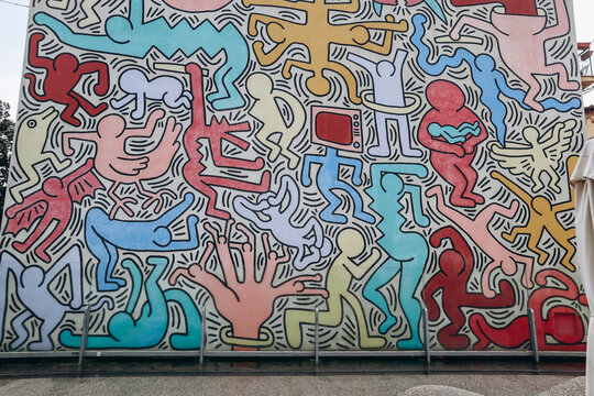 Pisa, Italy - 30 December 2023: Tuttomondo (English: All World), a mural created by American artist Keith Haring in 1989. Located on the rear wall of the Sant'Antonio Abate church in Pisa