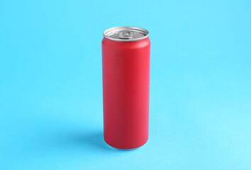 Energy drink in red can on light blue background