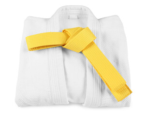 Yellow karate belt and kimono isolated on white