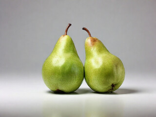Pair of halves of a green pear conference on white background.