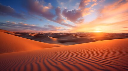 Fototapeta na wymiar Sunset over the sand dunes of the Sahara desert in Morocco