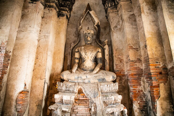 Buddha statues inside Wat Chaiwatthanaram temple in Ayutthaya Historical Park, Thailand