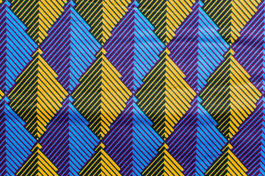 top view of blue ankara fabric, flatlay of nigerian wax cloth with designs, spread out blue ankara material