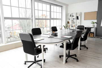 Interior of office with table prepared for meeting