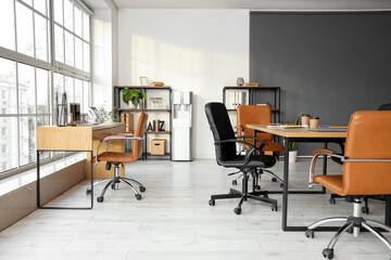 Interior of office with tables prepared for business meeting