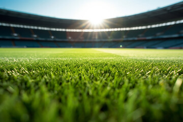Sunlit Soccer Field with Fresh Green Grass in an Empty Stadium. Sports Venue Concept - obrazy, fototapety, plakaty