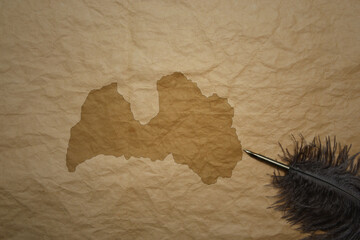 map of latvia on a old paper background with old pen