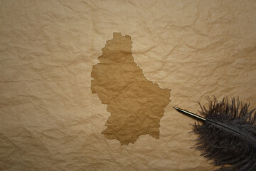 map of luxembourg on a old paper background with old pen