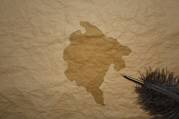 map of montenegro on a old paper background with old pen