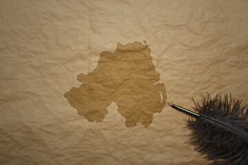 map of northern ireland on a old paper background with old pen