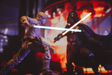 Naklejka premium NEW YORK USA, MAR 10 2024: recreation of a scene from Star Wars The Empire Strikes Back with Jedi Luke Skywalker battling Sith lord Darth Vader in the carbonite freezing chamber on Bespin - Hasbro