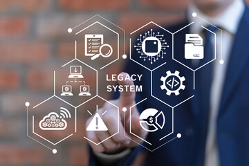 Man using virtual touch screen presses inscription: LEGACY SYSTEMS. Legacy System Business...