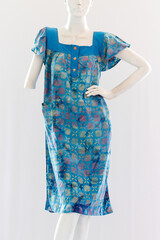 Comfortable women's negligee made from soft cotton, with short sleeves and clothing length that reaches above the knee.