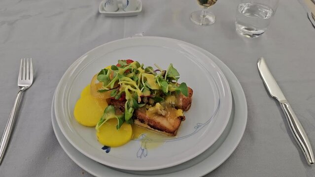 Food served on board of first class airplane on the table. First class travel. First class meal. 