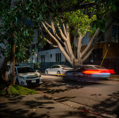 Сar driving on night street, long exposure shot. Los Angeles, California.