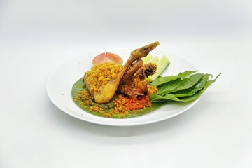 Ayam Goreng Kalasan, Indonesian food from Kalasan, Yogyakarta. It's fried chicken that cooked with special spice, combined with 'kremes', a crispy fried flour. Selective Focus