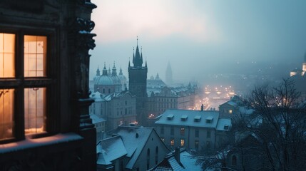 Beautiful historical buildings in winter with snow and fog in Prague city in Czech Republic in Europe.