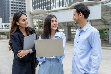 Confident business team is walking in a modern city, Make an appointment to meet with customers outside the office to negotiate business.