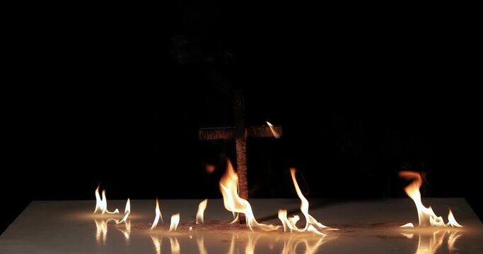 Fire around a burning cross symbol