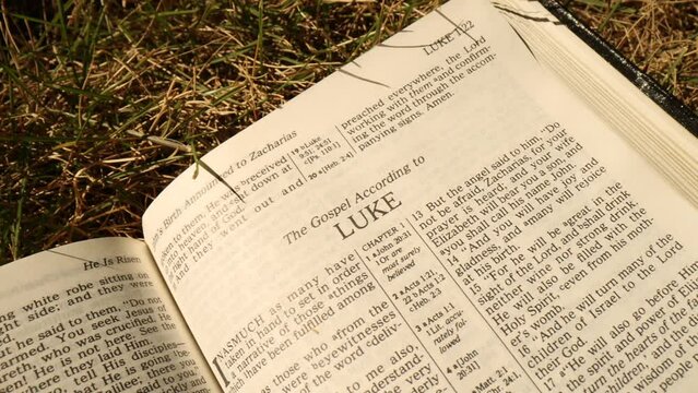Bible Opened to Gospel of Luke Title Page Outside