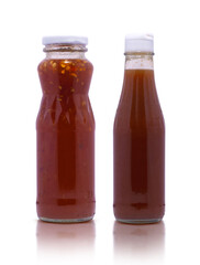 Bottles with tasty sauces isolated on white background