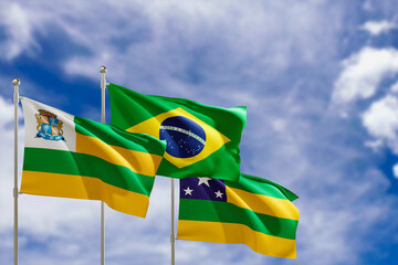 Official flags of the country Brazil, state of Sergipe and city of Aracaju. Swaying in the wind under the blue sky. 3d rendering