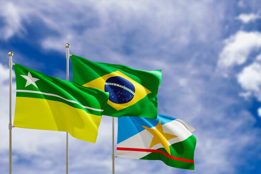 Official flags of the country Brazil, state of Roraima and city of Boa Vista. Swaying in the wind under the blue sky. 3d rendering