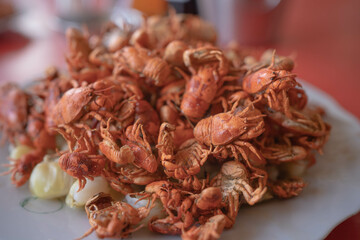 River crab crispy dish on red table.