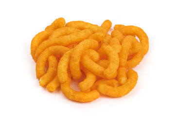 A pile of orange cheese corn puff snacks isolated on white
