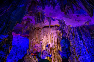 Papier Peint photo autocollant Guilin beautiful illuminated multicolored stalactites from karst Reed Flute cave