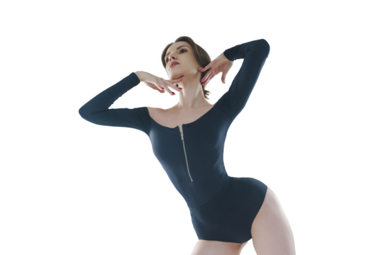waist portrait of a skinny ballerina in a black bodysuit posing in a photo studio showing dance moves