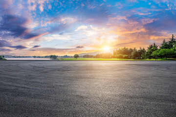 Asphalt road square and green forest natural landscape at sunset © ABCDstock
