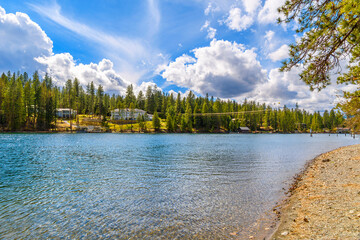 Waterfront luxury homes in the mountains of North Idaho along the Spokane River viewed from the...