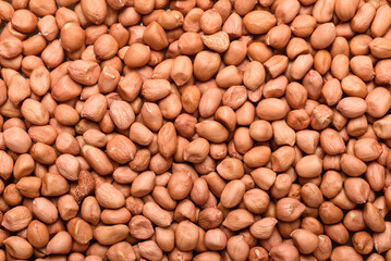 Peanut seeds, an ingredient for making vegetarian and healthy food. Close-up image of food background texture
