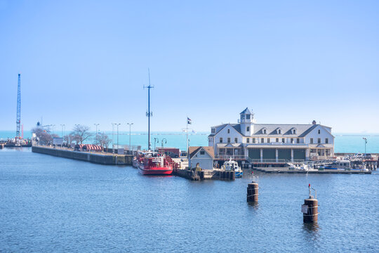 South Pier on Chicago River looking out towards Chicago Firehouse and Lake Michigan. Chicago Fireboats in foreground