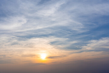 Fototapeta premium Dramatic cloudy sky and bright sunrise or sunset over the horizon. Natural skyscape background