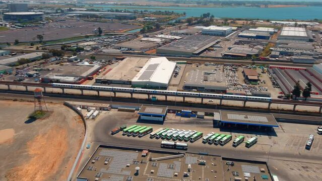 Oakland BART Train Passing Industrial Landscape