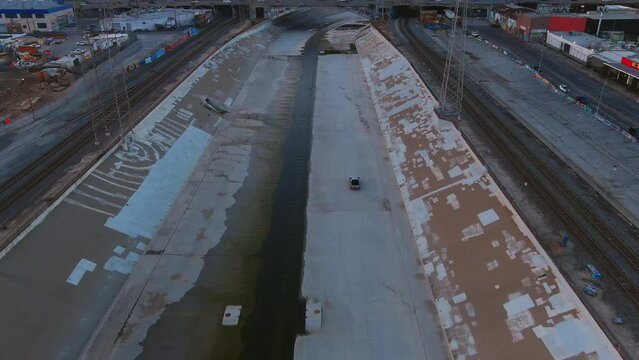 Car Driving Through Los Angeles River Canal