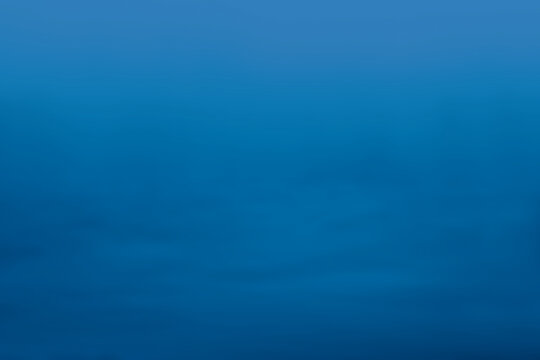 Dark blue background texture with light haze.